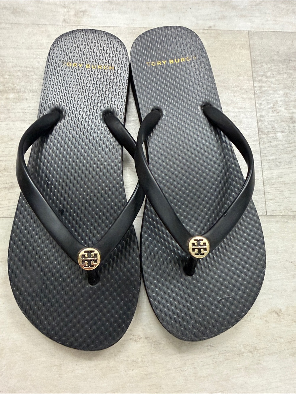 Tory Burch Black Flip-Flops with Gold Logo Emblem